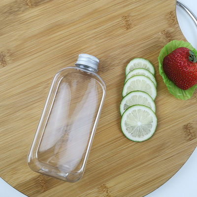 帽子ジュースのミルクのプラスチック スムージーのびんが付いている平らな300ml PLAの水差し